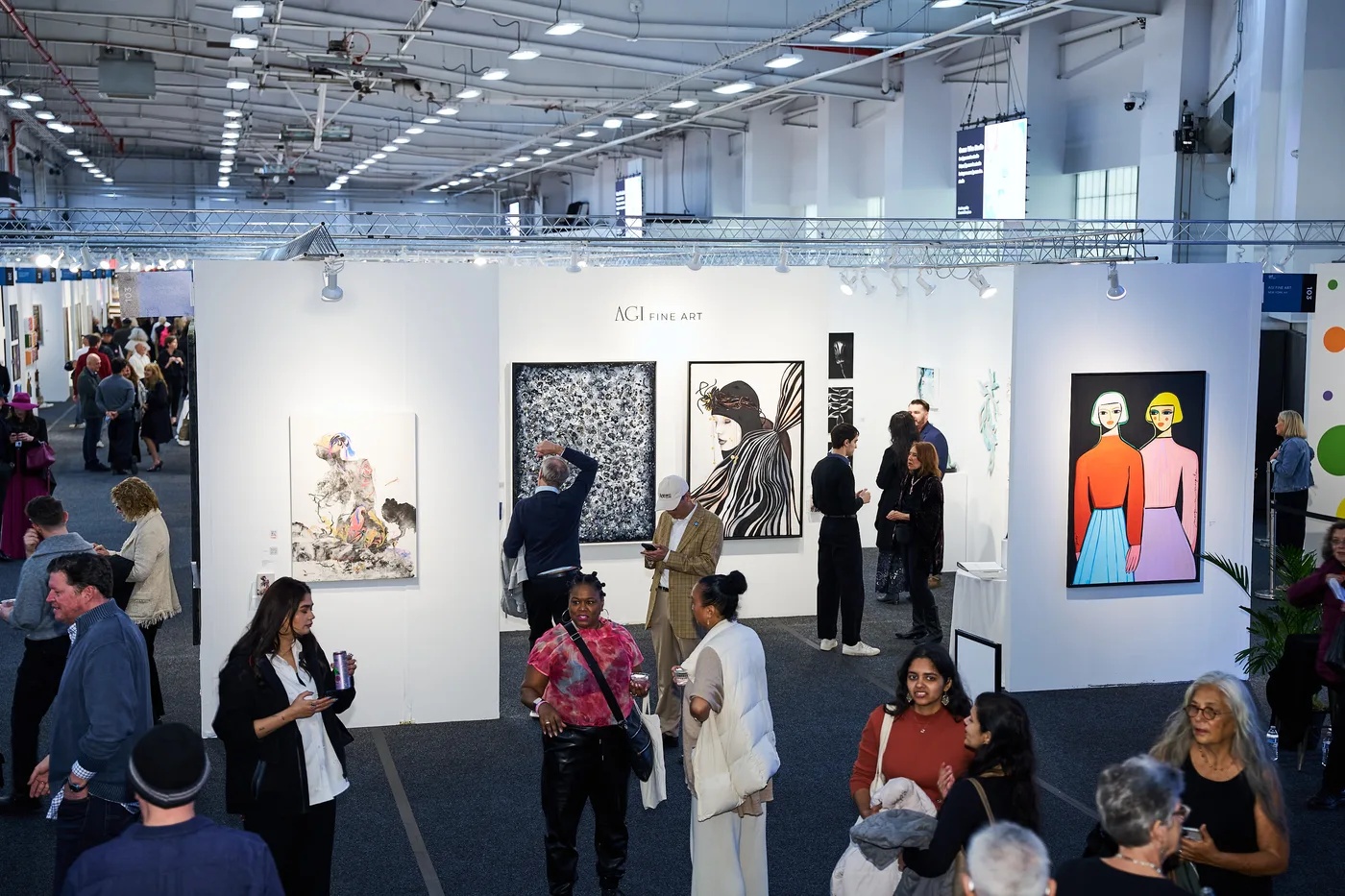 The AGI Fine Art booth seen across the fair floor at Artexpo New York, April 2025, Pier 36