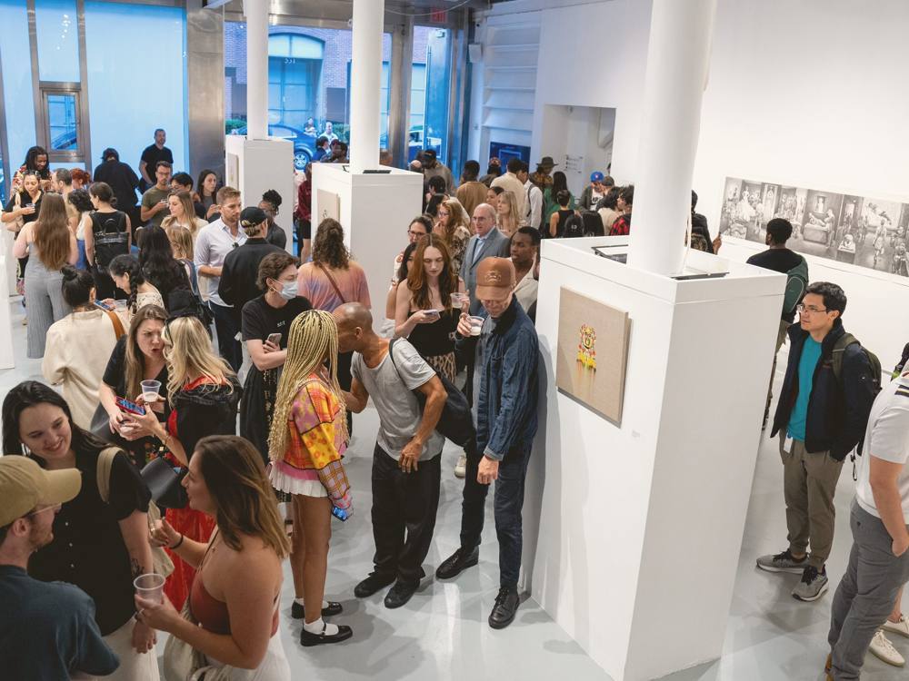 A crowd at an opening in the Chelsea gallery