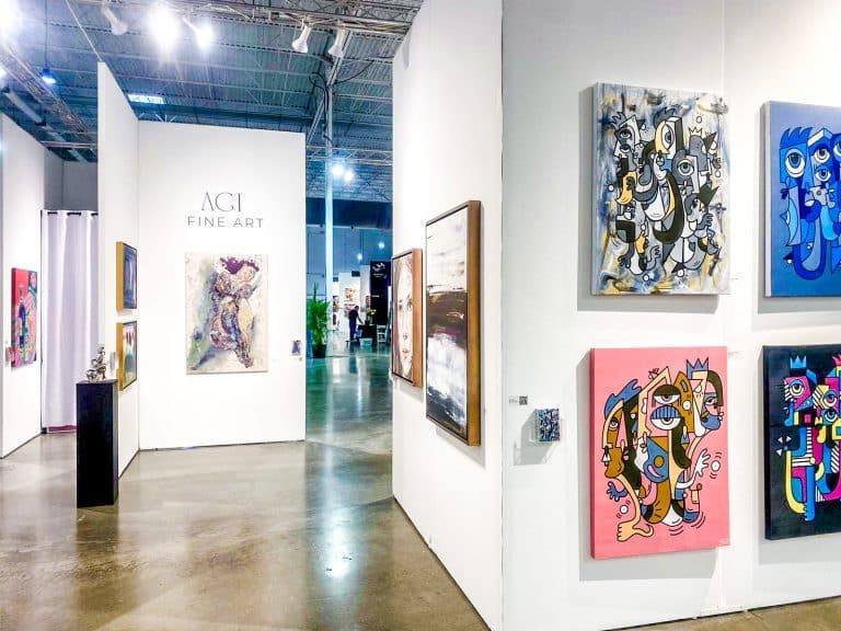 Paintings hung in an AGI Fine Art booth