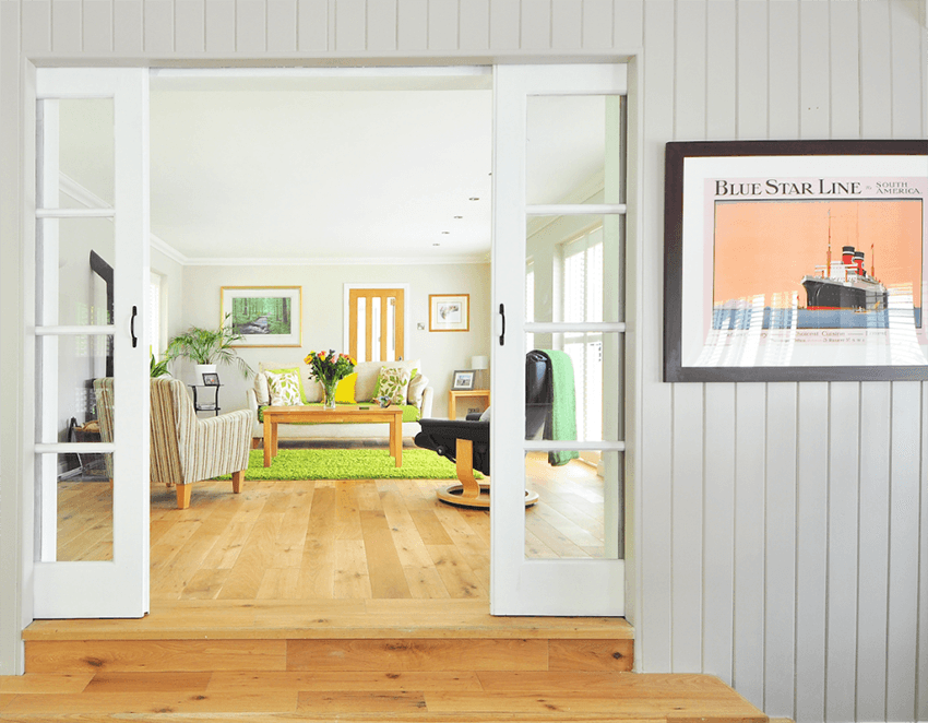 A framed photo mounted to a wall in a house