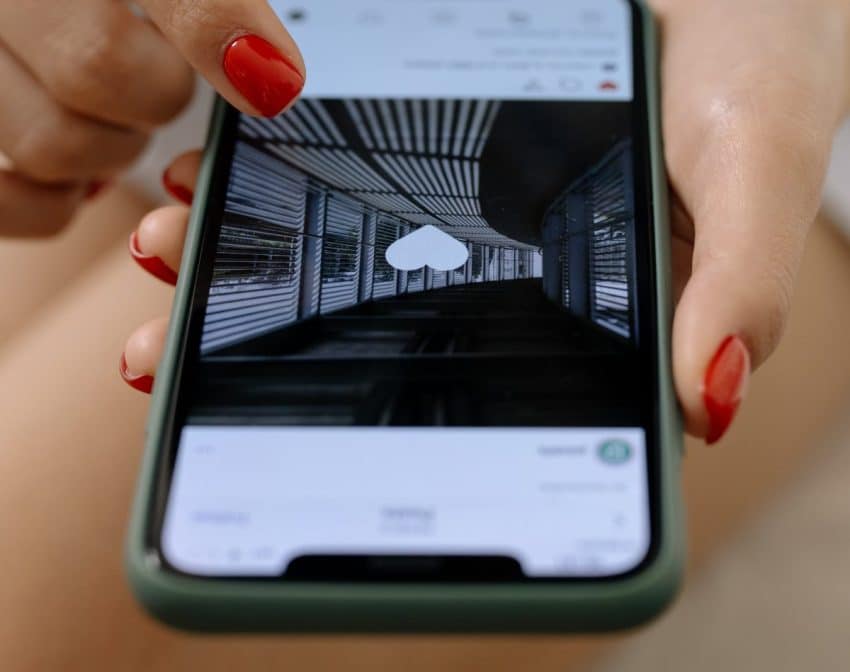 Woman pressing like button on Instagram Feed