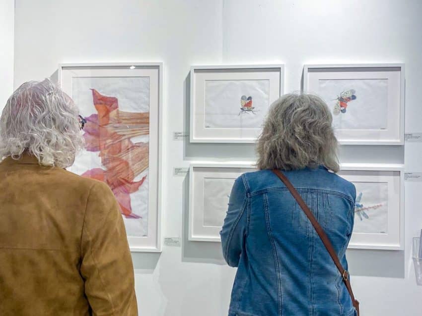 Guests at the AGI Fine Art Booth during Red Dot Miami 2023
