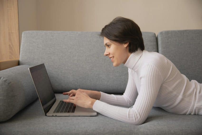 Photo Of Person Using Laptop to Customize Facebook Business Page