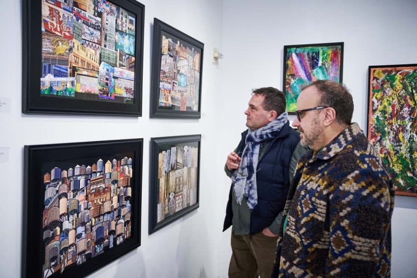 Visitor Engaging with Art at AGI Fine Art’s ‘New York, I Love You’ Exhibition