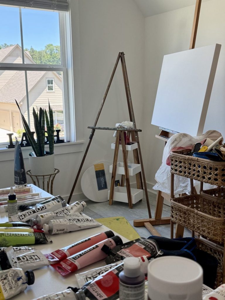 Bright home art studio of artist Sherri Springer, illustrating how a personal studio environment influences creativity and artistic practice.